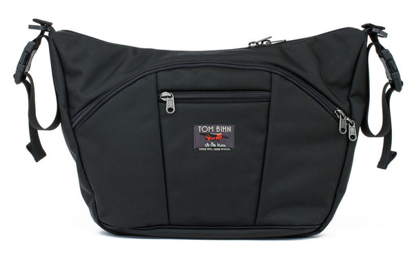 A pair of stroller/wheelchair adapter straps attached to the shoulder strap d-rings of a Parental Unit in Black 525 Ballistic.